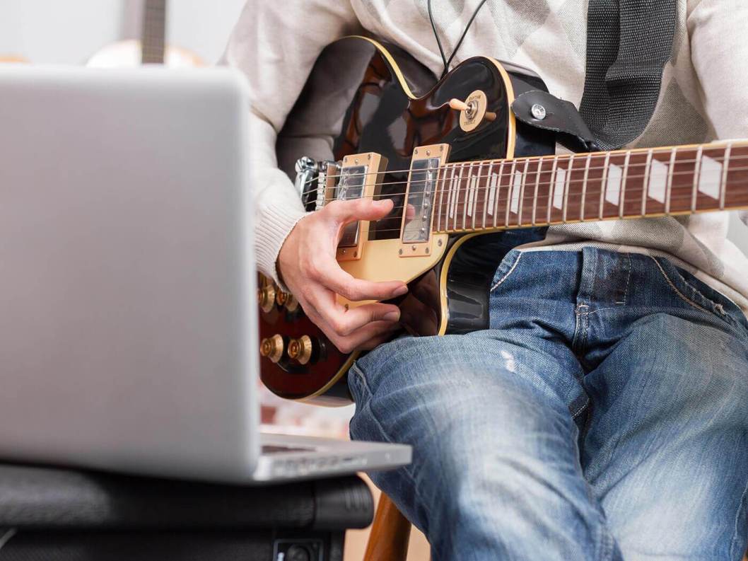 online guitar lesson laptop practice at home